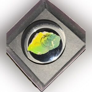 1989 Berlin Wall Remnant encased in Lucite-Paper weight. From Time Warner